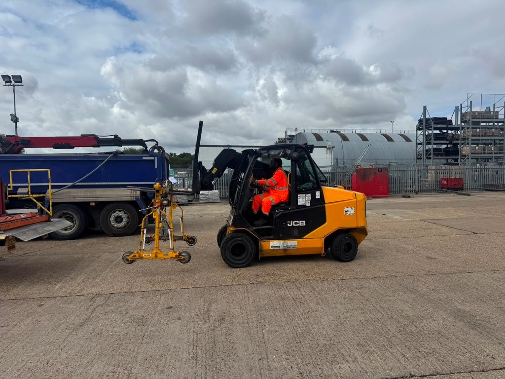 AJ Safety Services JCB forklift operator working with specialist lifting equipment in a UK yard