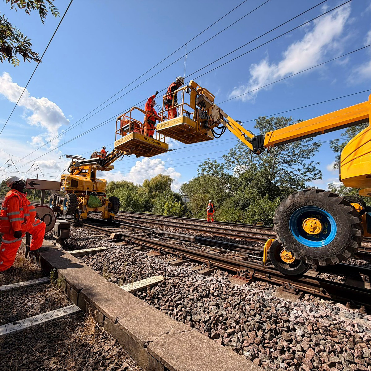 Network Rail overhead line team working from rail access platforms