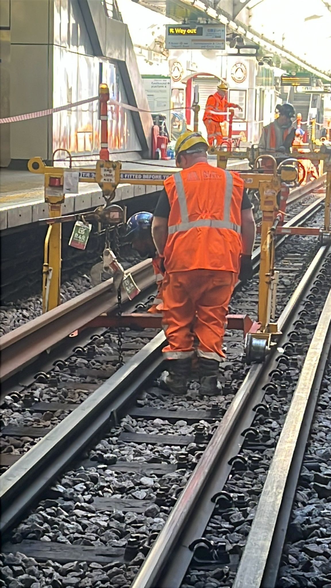 Track operative walking through a London Underground engineering worksite