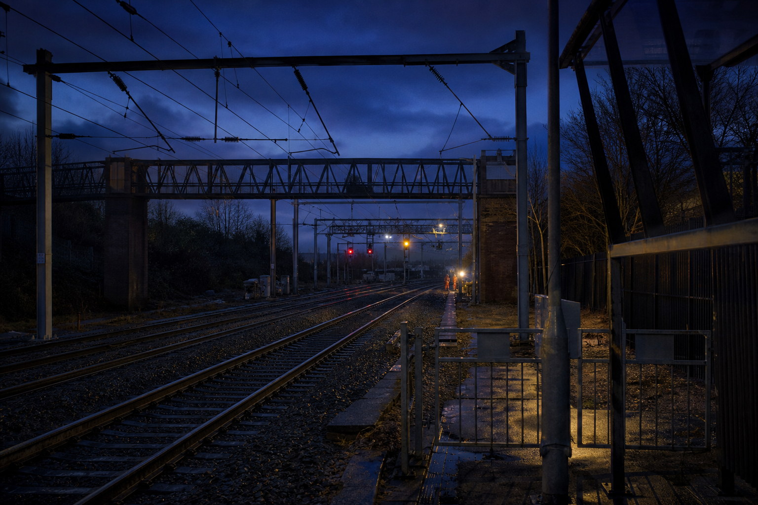 Electrified UK mainline railway at blue hour